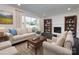 Staged living room with a cozy seating arrangement, a fireplace, dark hardwood floors and bright natural light at 2286 Kilborne Dr, Charlotte, NC 28205