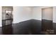 Bright, open living room featuring dark hardwood floors and neutral walls at 2286 Kilborne Dr, Charlotte, NC 28205