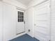 Mud room featuring white brick wall and blue floor at 2286 Kilborne Dr, Charlotte, NC 28205