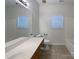 Bright bathroom features tile flooring, a large mirror, and neutral walls at 235 Glenville Dr, Fort Mill, SC 29715