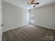Spacious bedroom with neutral walls, carpet and bright, natural light from windows at 235 Glenville Dr, Fort Mill, SC 29715