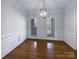Elegant dining room featuring hardwood floors, decorative molding, and natural light at 235 Glenville Dr, Fort Mill, SC 29715