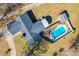 An overhead view reveals a home with a backyard swimming pool, patio area, and a neatly kept lawn surrounded by foliage at 2659 Surrey Dr, Lincolnton, NC 28092