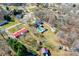 An aerial view of a home with a long drive, in-ground pool, outbuilding, and spacious partially-wooded yard at 2659 Surrey Dr, Lincolnton, NC 28092