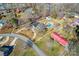 Aerial view of a nice home with a large yard, shed, and in-ground pool on a sunny day at 2659 Surrey Dr, Lincolnton, NC 28092