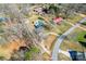 Aerial view of the property showcasing its expansive lot, in-ground pool, and proximity to surrounding neighborhood streets at 2659 Surrey Dr, Lincolnton, NC 28092