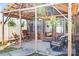 Cozy porch featuring a wooden patio cover, wood rocking chairs, and hanging plants for a relaxing outdoor space at 2659 Surrey Dr, Lincolnton, NC 28092