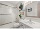 Bright bathroom featuring a shower with glass doors and a white vanity with decor for a clean, modern look at 2659 Surrey Dr, Lincolnton, NC 28092
