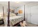 Cozy bedroom featuring a four poster bed, soft natural light, and neutral walls creating a relaxing and inviting atmosphere at 2659 Surrey Dr, Lincolnton, NC 28092