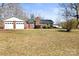 Charming home with a brick facade, well-manicured lawn, and an attached two-car garage, creating a welcoming curb appeal at 2659 Surrey Dr, Lincolnton, NC 28092