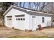 Spacious two-car garage, offering ample parking and storage space, with a side door for easy access to the property at 2659 Surrey Dr, Lincolnton, NC 28092