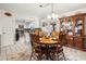 Eat-in kitchen featuring tile floors, a wooden dining table, and view of the kitchen appliances at 2659 Surrey Dr, Lincolnton, NC 28092