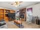 Inviting living room with a brick fireplace, hardwood floors, and wooden built in shelves at 2659 Surrey Dr, Lincolnton, NC 28092