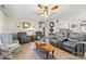 Comfortable living room with hardwood floors, gray furniture and vintage rocking chair at 2659 Surrey Dr, Lincolnton, NC 28092