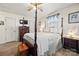 Bedroom with a four poster bed, wood floors, and modern ceiling fan at 2659 Surrey Dr, Lincolnton, NC 28092