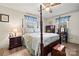Bedroom with a decorative four poster bed, wood floors, and vintage furniture at 2659 Surrey Dr, Lincolnton, NC 28092