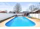 Large in-ground pool featuring a concrete patio, lounge chairs and a large privacy fence at 2659 Surrey Dr, Lincolnton, NC 28092