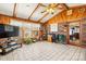 Spacious sunroom with wood paneled ceiling and walls, ceramic tile flooring, and lots of natural light at 2659 Surrey Dr, Lincolnton, NC 28092