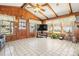 Cozy sunroom with wood accents, tile flooring, a large window and exterior door at 2659 Surrey Dr, Lincolnton, NC 28092