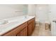 Bathroom features a double sink vanity, tiled floor, and shower/tub combo at 2988 Clover Nw Rd, Concord, NC 28027