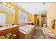 Bright bathroom featuring a tub, double sink vanity, and walk-in shower at 2988 Clover Nw Rd, Concord, NC 28027