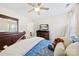 Cozy bedroom features a ceiling fan, dresser, and a large mirror at 2988 Clover Nw Rd, Concord, NC 28027