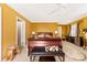 Bedroom featuring a ceiling fan, window, bench and night stands at 2988 Clover Nw Rd, Concord, NC 28027