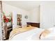 Bedroom features a large bed, a TV mounted to the wall, and an open doorway to another room at 2988 Clover Nw Rd, Concord, NC 28027