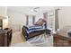 Comfortable bedroom featuring a ceiling fan, carpet, and natural light from the window at 2988 Clover Nw Rd, Concord, NC 28027