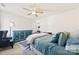 Relaxing bedroom featuring a ceiling fan, accent chair, and area rug at 2988 Clover Nw Rd, Concord, NC 28027