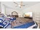 Spacious bedroom with a ceiling fan, television, and a dresser with large mirror at 2988 Clover Nw Rd, Concord, NC 28027