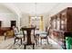 The formal dining room is filled with antique furniture, a decorative rug, and natural light from the window at 2988 Clover Nw Rd, Concord, NC 28027