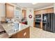 Well-lit kitchen features stainless steel appliances, granite countertops, and tile flooring at 2988 Clover Nw Rd, Concord, NC 28027