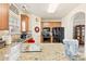 Bright kitchen boasts granite countertops, tile flooring, and stainless steel appliances at 2988 Clover Nw Rd, Concord, NC 28027