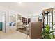 Cozy living room with plush seating, bookshelves, and neutral carpeting at 2988 Clover Nw Rd, Concord, NC 28027