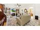 Comfortable living room boasts a fireplace, a television, and an open view to the eat-in kitchen at 2988 Clover Nw Rd, Concord, NC 28027
