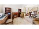 Cozy living room with fireplace, built-in bookshelves, an arm chair, and open view to the dining area at 2988 Clover Nw Rd, Concord, NC 28027