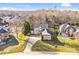 Aerial view of the brick home, showcasing its manicured lawn and neighborhood at 305 Chancelot Ln, Fort Mill, SC 29708