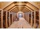 Spacious unfinished attic space with exposed beams and rocking chairs at 305 Chancelot Ln, Fort Mill, SC 29708