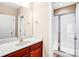 Bathroom with a vanity featuring a dark wood cabinet and glass enclosed shower at 305 Chancelot Ln, Fort Mill, SC 29708