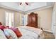 Serene bedroom with tray ceiling, neutral walls and a beautiful headboard at 305 Chancelot Ln, Fort Mill, SC 29708