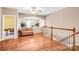 Upstairs bonus room with hardwood floors and comfortable seating area at 305 Chancelot Ln, Fort Mill, SC 29708