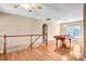 Spacious upstairs bonus room with a pool table and natural light at 305 Chancelot Ln, Fort Mill, SC 29708