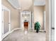 Elegant entryway featuring marble floors, decorative columns, and a view to the kitchen at 305 Chancelot Ln, Fort Mill, SC 29708