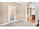 Welcoming foyer featuring marble floors, arched doorway, and decorative columns at 305 Chancelot Ln, Fort Mill, SC 29708