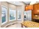 Bright kitchen featuring a stainless steel refrigerator, eat in nook, and granite countertops at 305 Chancelot Ln, Fort Mill, SC 29708