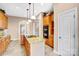 Well-appointed kitchen with granite countertops, island cooktop, and double wall ovens at 305 Chancelot Ln, Fort Mill, SC 29708