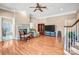 Inviting living room with fireplace, hardwood floors, and ample natural light at 305 Chancelot Ln, Fort Mill, SC 29708
