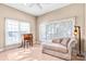 Comfortable sitting room with tile floors, a daybed and two bright windows at 305 Chancelot Ln, Fort Mill, SC 29708
