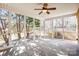 Enclosed sunroom featuring multiple windows and a concrete tile floor at 305 Chancelot Ln, Fort Mill, SC 29708